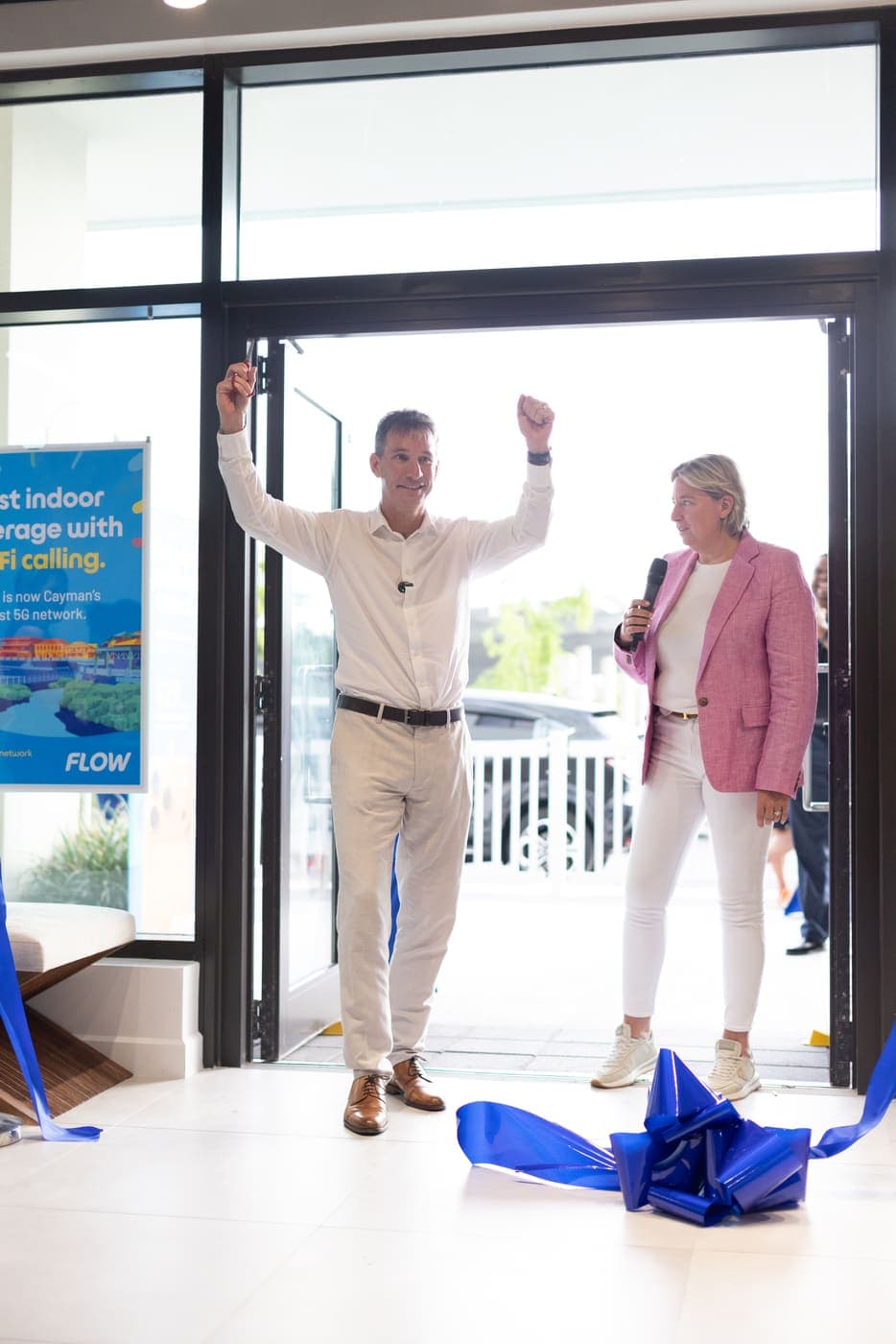 The ribbon cutting at the new Flow flagship store in Camana Bay