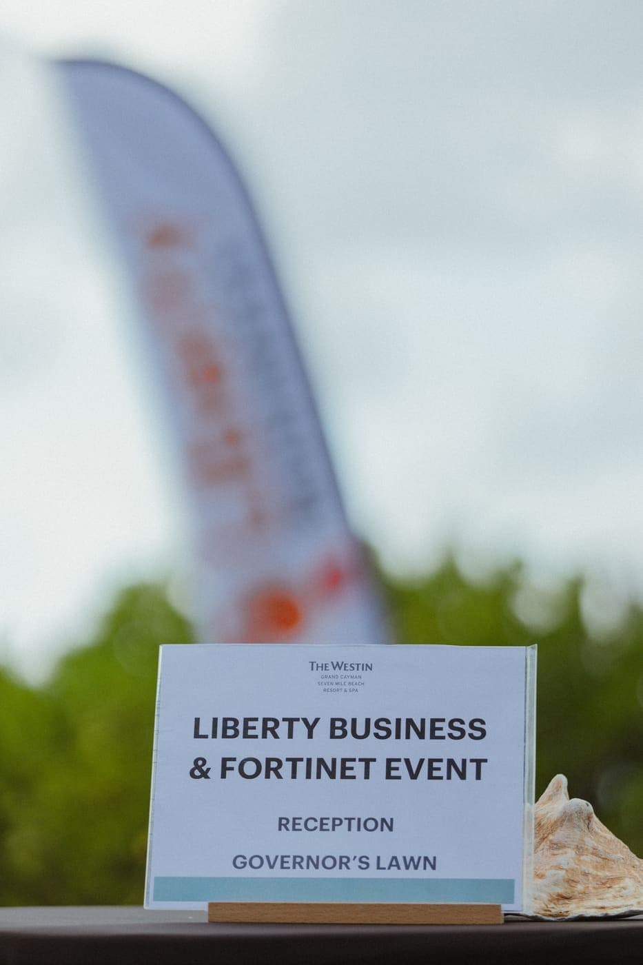 Table sign: Liberty Business & Fortinet event, reception, Governor’s Lawn