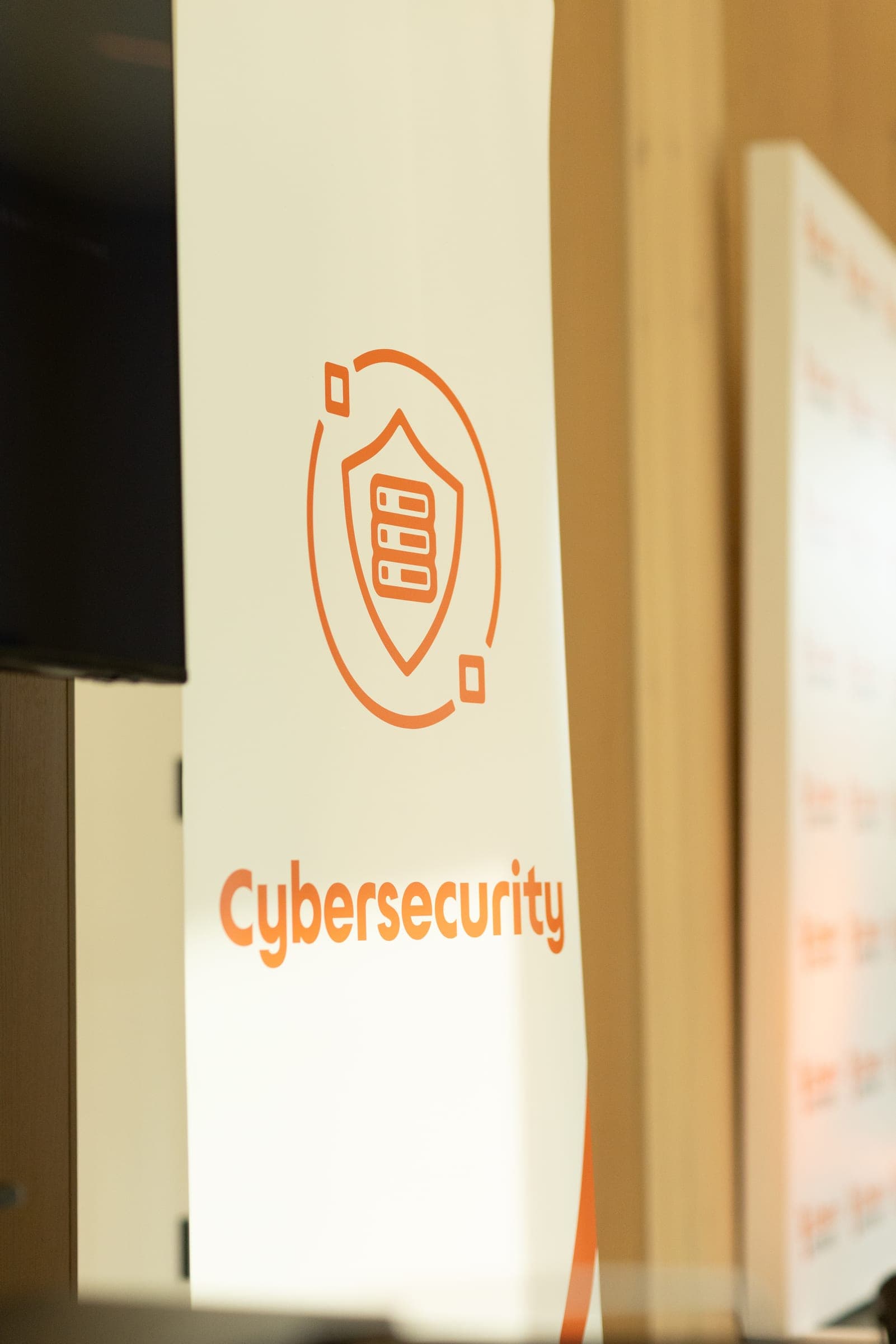 Close-up of an orange and white Liberty Business Cybersecurity banner